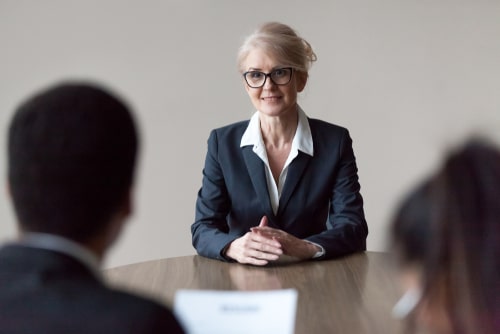 Middle aged woman in job interview, Encino age discrimination lawyer concept